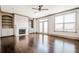 Spacious living room boasting a fireplace, custom built-ins, and access to outdoor patio at 1435 Druid Manor, Atlanta, GA 30329