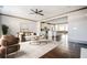 Open-concept living room with hardwood floors and seamless flow into the kitchen and dining area at 1435 Druid Manor, Atlanta, GA 30329