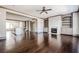 Open-concept living room featuring a fireplace, built-in shelving, and rich hardwood floors at 1435 Druid Manor, Atlanta, GA 30329