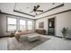 Spacious primary bedroom with tray ceiling, carpeted floors, ensuite bathroom, and plenty of natural light at 1435 Druid Manor, Atlanta, GA 30329
