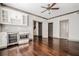 Inviting room featuring hardwood floors, custom cabinetry with a wet bar, and ample space at 1435 Druid Manor, Atlanta, GA 30329