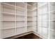 Spacious walk-in closet featuring custom white shelving for ample storage and organization at 1435 Druid Manor, Atlanta, GA 30329
