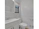 White bathroom featuring single vanity and new toilet at 361 Gordon Valley Sw Ln, Mableton, GA 30126