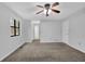 Cozy bedroom with view of trees, ceiling fan and closet at 361 Gordon Valley Sw Ln, Mableton, GA 30126