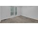 Bright bedroom features a neutral carpet and two windows at 361 Gordon Valley Sw Ln, Mableton, GA 30126