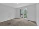 Neutral bedroom with large windows, carpet and neutral paint at 361 Gordon Valley Sw Ln, Mableton, GA 30126