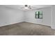 Bedroom featuring carpet, ceiling fan, and a view of trees at 361 Gordon Valley Sw Ln, Mableton, GA 30126