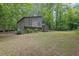Charming two-story home featuring unique architectural design and nestled among lush, mature trees at 361 Gordon Valley Sw Ln, Mableton, GA 30126