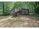 Attractive angle of the home showcases a cozy, covered entrance and natural surroundings at 361 Gordon Valley Sw Ln, Mableton, GA 30126