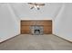Open living area with cozy stone fireplace, wood wall, neutral carpet, and high vaulted ceilings at 361 Gordon Valley Sw Ln, Mableton, GA 30126