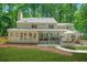 Expansive backyard featuring a spacious deck, manicured lawn, and lush green landscaping creating a private oasis at 3870 Windhurst Dr, Lilburn, GA 30047