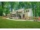 Beautiful backyard with a spacious deck, and lush green landscaping creating a private oasis at 3870 Windhurst Dr, Lilburn, GA 30047
