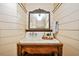Bathroom sink with vintage mirror and unique shiplap wall design at 3870 Windhurst Dr, Lilburn, GA 30047