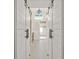 Hallway bathroom featuring decorative floor tile and barn door access at 3870 Windhurst Dr, Lilburn, GA 30047