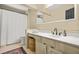 Neutral bathroom featuring a shower with curtain, large mirror, vanity and rug at 3870 Windhurst Dr, Lilburn, GA 30047