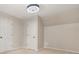 Neutral bedroom features a ceiling fan, carpet and two doors at 3870 Windhurst Dr, Lilburn, GA 30047