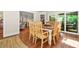 Dining area boasts hardwood floors, natural light, and a smooth transition to outdoor living at 3870 Windhurst Dr, Lilburn, GA 30047