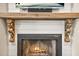 Close-up view of the fireplace with decorative wooden corbels and a rustic wood mantel at 3870 Windhurst Dr, Lilburn, GA 30047