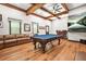 Large game room features a pool table, media area, and a seating area for entertaining at 3870 Windhurst Dr, Lilburn, GA 30047