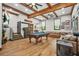 Entertaining game room with a pool table, ample seating, wooden beams, and stylish decor at 3870 Windhurst Dr, Lilburn, GA 30047