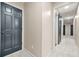 Hallway features a blend of carpet and hardwood floors, with access to multiple rooms at 3870 Windhurst Dr, Lilburn, GA 30047