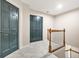Hallway with gray carpet, white trim, and two dark blue doors at 3870 Windhurst Dr, Lilburn, GA 30047