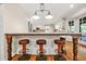 Kitchen island with seating for four, overlooking the kitchen and back porch at 3870 Windhurst Dr, Lilburn, GA 30047