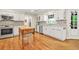 Kitchen view showing stainless steel oven, island, cabinets, and hardware at 3870 Windhurst Dr, Lilburn, GA 30047