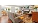 Cozy living room with a fireplace, built-in shelves, and comfortable seating at 3870 Windhurst Dr, Lilburn, GA 30047