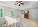 Main bedroom with windows, trey ceiling, and private access to outdoor living at 3870 Windhurst Dr, Lilburn, GA 30047