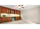 Home office featuring custom built-in cabinetry, drawers, and ample workspace at 3870 Windhurst Dr, Lilburn, GA 30047