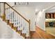 Staircase with wood and carpet, leading to the upper level, adjacent to the office at 3870 Windhurst Dr, Lilburn, GA 30047