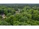 An aerial view of a neighborhood with tree-lined streets and well-maintained homes at 3924 Lorien Nw Way, Kennesaw, GA 30152