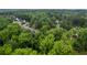 Aerial view of homes surrounded by trees in a suburban neighborhood, showcasing landscape at 3924 Lorien Nw Way, Kennesaw, GA 30152