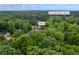 Aerial view of the Kennesaw, GA, home near Lewis Elementary School, surrounded by lush greenery at 3924 Lorien Nw Way, Kennesaw, GA 30152