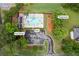 This aerial view highlights community amenities, including a sparkling pool, pool house, and playground at 3924 Lorien Nw Way, Kennesaw, GA 30152