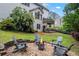 Cozy backyard fire pit area with Adirondack chairs, perfect for relaxing evenings at 3924 Lorien Nw Way, Kennesaw, GA 30152