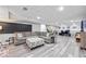 Finished basement with a large sectional sofa, ottoman, and desk workspace at 3924 Lorien Nw Way, Kennesaw, GA 30152