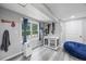 Basement area with a window view, dog kennel, blue beanbag chair, and painted gray walls at 3924 Lorien Nw Way, Kennesaw, GA 30152