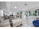 Spacious finished basement with a comfortable seating area, desk, and natural light at 3924 Lorien Nw Way, Kennesaw, GA 30152
