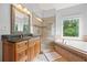 This bathroom features double sinks, a walk-in shower with tile surround, and a separate soaking tub at 3924 Lorien Nw Way, Kennesaw, GA 30152
