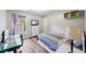 Cozy bedroom featuring a twin bed, desk, and window with natural light at 3924 Lorien Nw Way, Kennesaw, GA 30152
