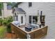 Outdoor deck with a seating area, umbrella, and view of the backyard at 3924 Lorien Nw Way, Kennesaw, GA 30152