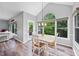 Bright dining area with a large window offering scenic views, and a door leading to an outdoor space at 3924 Lorien Nw Way, Kennesaw, GA 30152