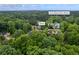 Aerial view of the Kennesaw, GA, home near Lewis Elementary School, with an inviting backyard fire pit at 3924 Lorien Nw Way, Kennesaw, GA 30152