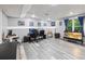 Basement game room featuring gray luxury vinyl floors and a window with natural light at 3924 Lorien Nw Way, Kennesaw, GA 30152