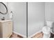 Clean half bathroom with a modern toilet and vanity with stylish design at 3924 Lorien Nw Way, Kennesaw, GA 30152