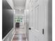 Hallway leading to the kitchen with view of dining area, chalkboard, and neutral color palette at 3924 Lorien Nw Way, Kennesaw, GA 30152