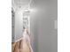 Hallway with wood-look floors and neutral walls leading to bedrooms at 3924 Lorien Nw Way, Kennesaw, GA 30152