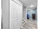 Hallway features gray floors, stairs, and a large closet in a finished basement at 3924 Lorien Nw Way, Kennesaw, GA 30152